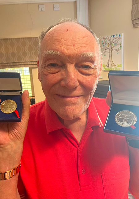 Roy Anthony Edwards pictured with his two medals (Photo courtesy of Roy)
